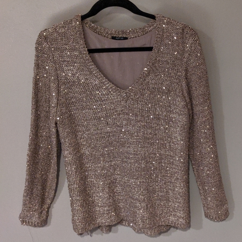Beige sweater that sparkles and glimmers